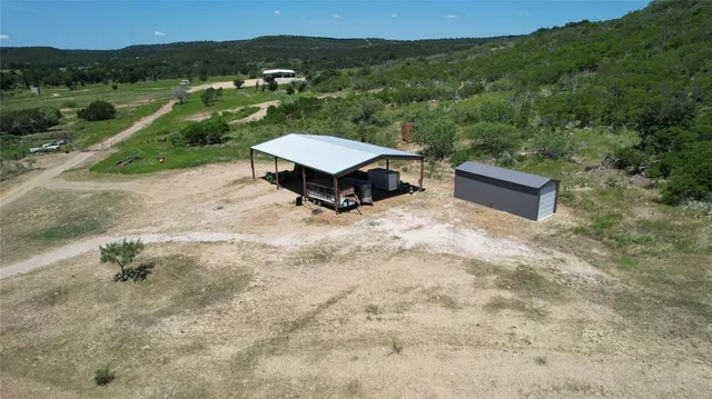 an aerial view of a house having yard