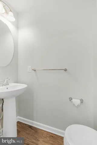 a bathroom with a sink a toilet and vanity