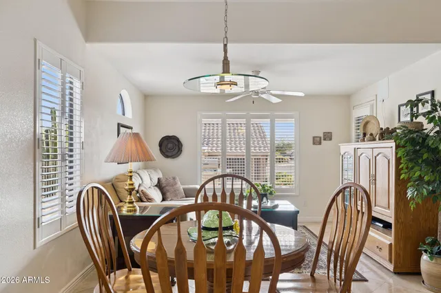 a view of a bedroom with wooden floor