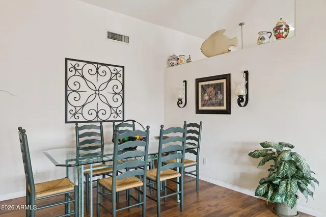 a view of a dining room with furniture window and outside view