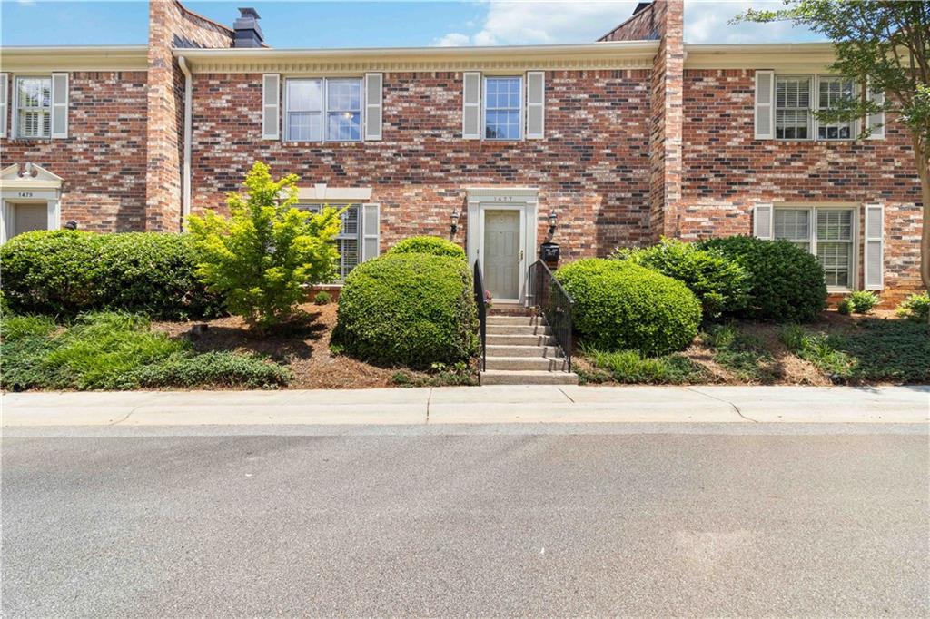 1477 Leafview Road Decatur, GA 30033 - Photo 1 of 1 a view of a building with a yard and a street
