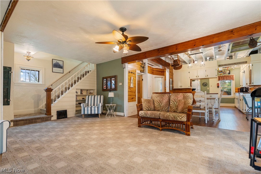 120 34th Street Southwest Canton, OH 44706 - Photo 5 of 30 Carpeted living room featuring beamed ceiling and ceiling fan