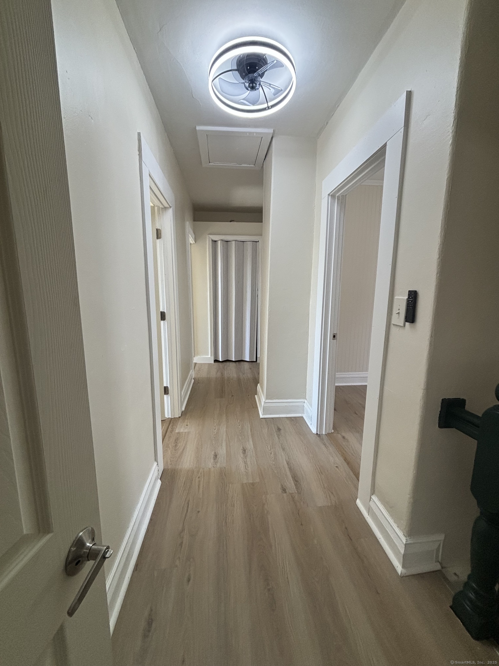 161 Cliff Street Norwich, CT 06360 - Photo 11 of 14 a view of a hallway with wooden floor