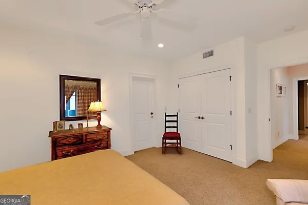 a kitchen with a sink a stove top oven a counter space and a window