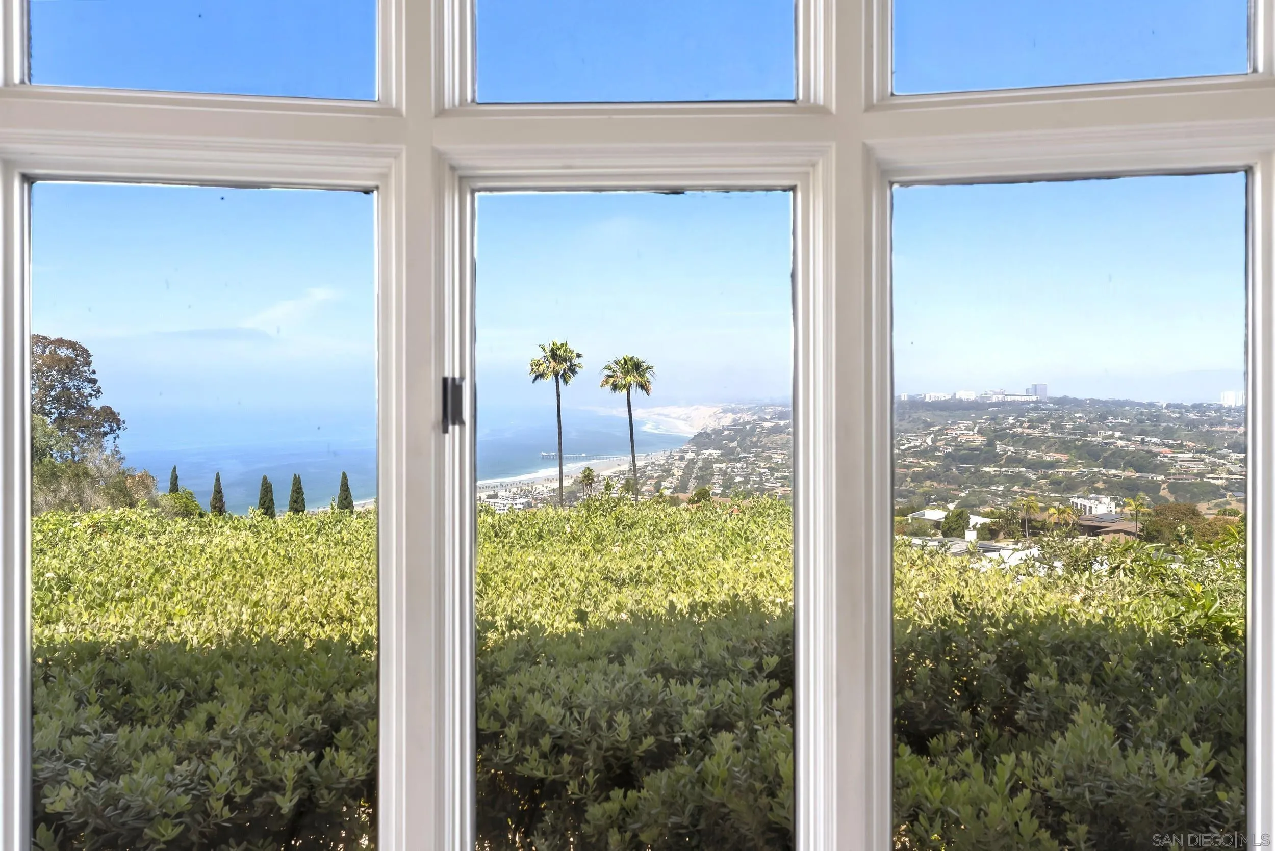 2302 Rue Adriane La Jolla, CA 92037 - Photo 13 of 31 a view of a glass door and a yard from a window