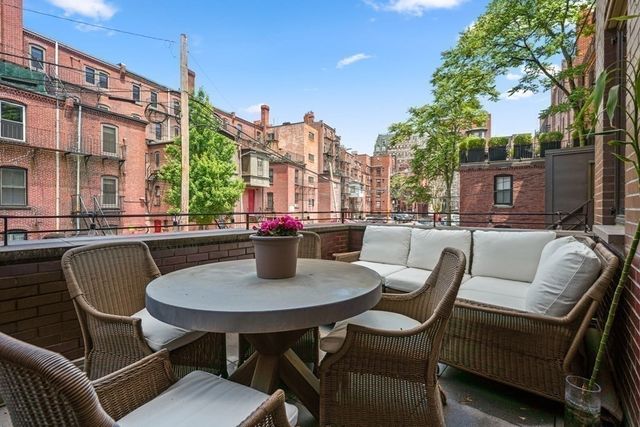 a outdoor space with patio the couches and a potted plant