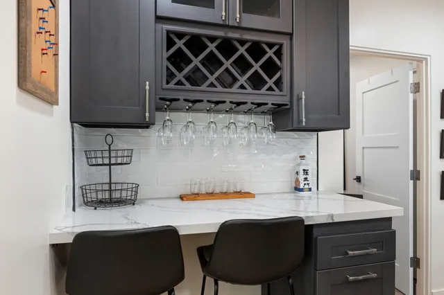 a kitchen with a sink cabinets and window