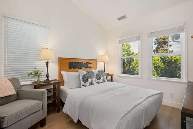 a bedroom with a bed and a couch