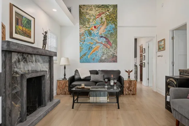 a living room with furniture and a fireplace