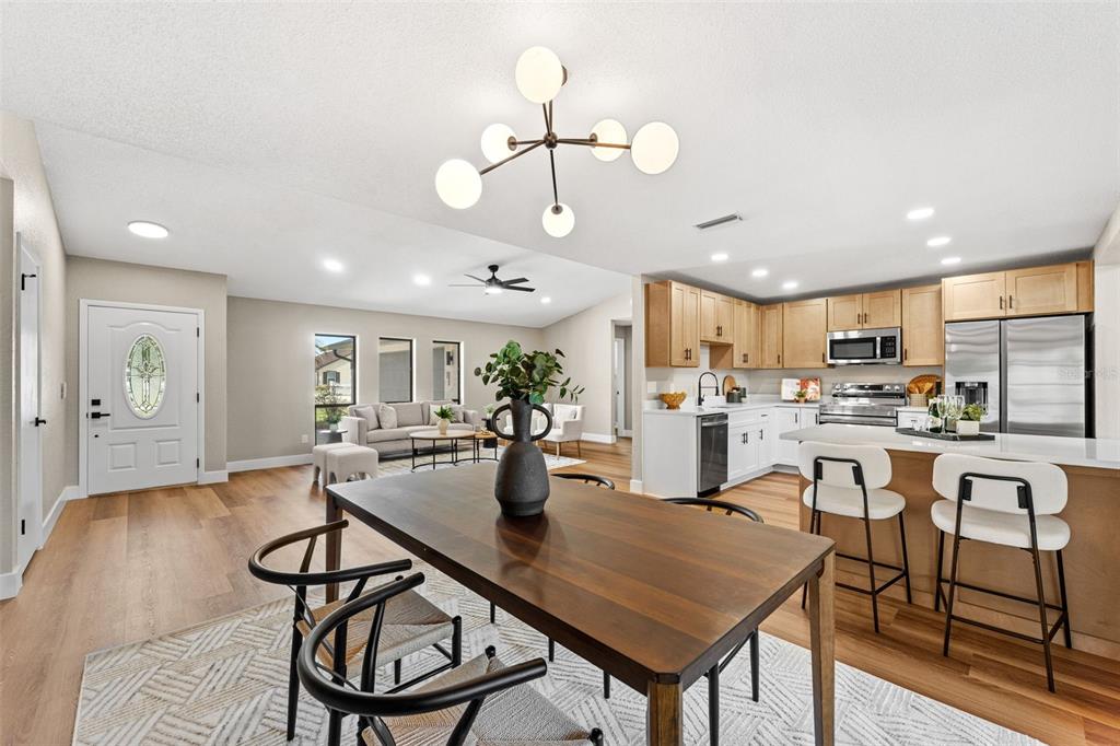 117 Poinciana Road Edgewater, FL 32141 - Photo 14 of 36 a view of a dining room with furniture window and wooden floor