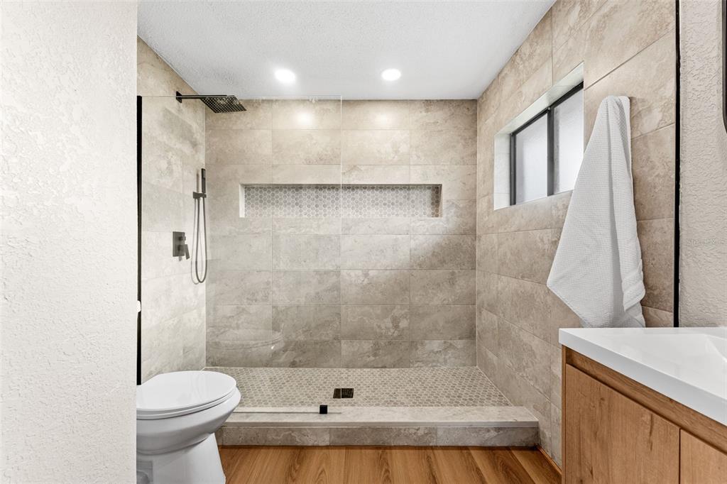 117 Poinciana Road Edgewater, FL 32141 - Photo 18 of 36 a bathroom with a bathtub and a toilet
