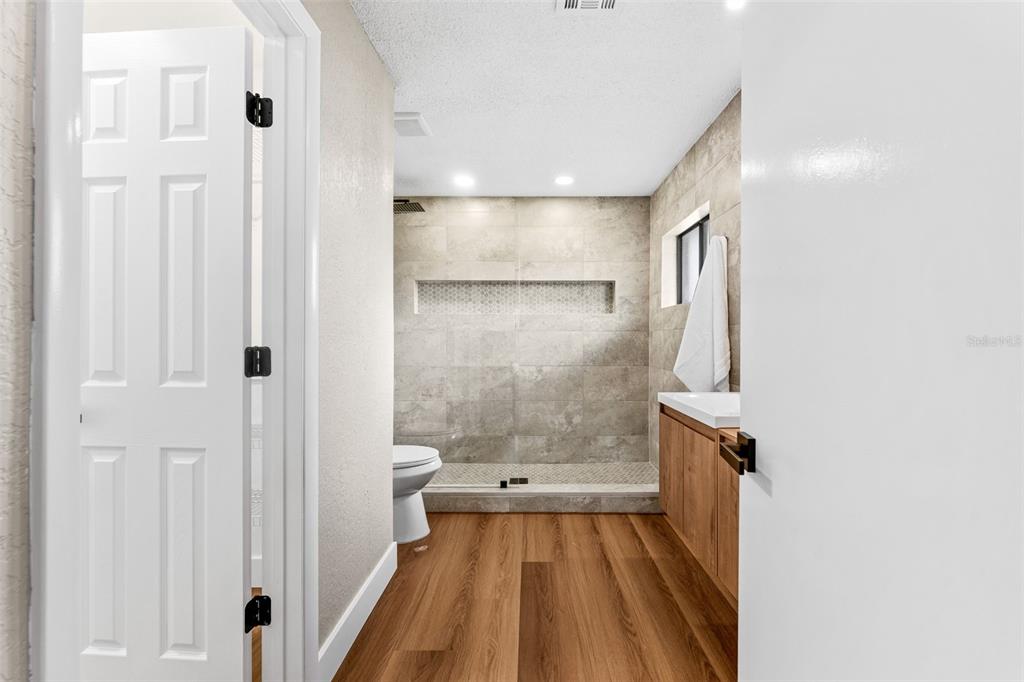 117 Poinciana Road Edgewater, FL 32141 - Photo 20 of 36 a bathroom with a sink and a shower