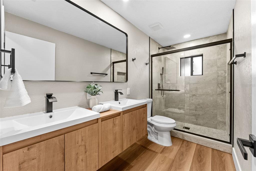117 Poinciana Road Edgewater, FL 32141 - Photo 25 of 36 a bathroom with a sink toilet and shower