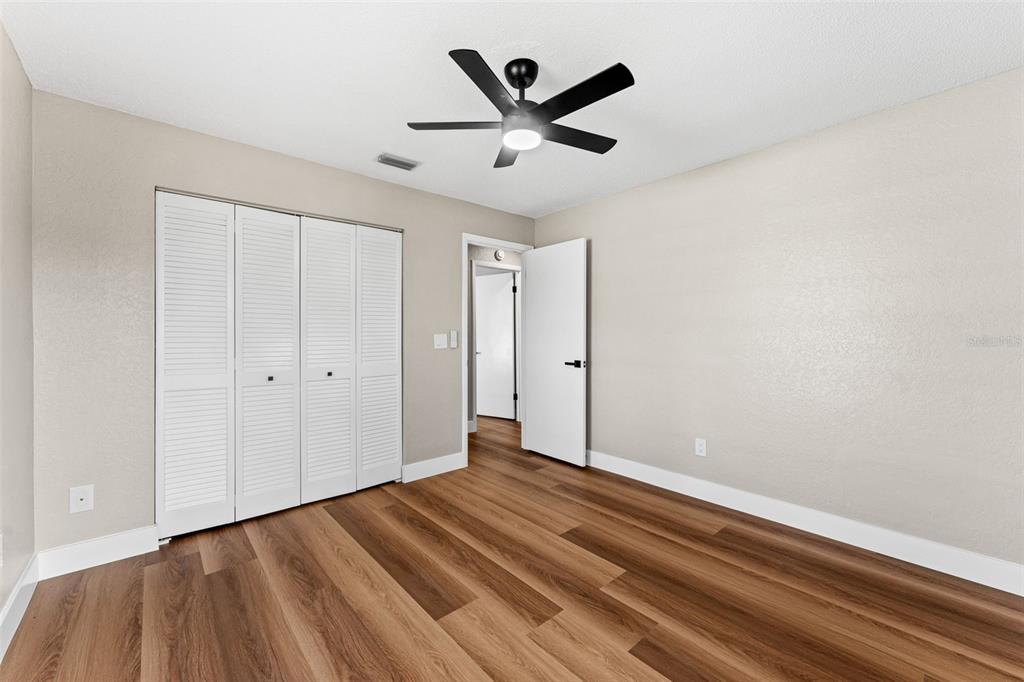 117 Poinciana Road Edgewater, FL 32141 - Photo 27 of 36 a view of empty room with wooden floor