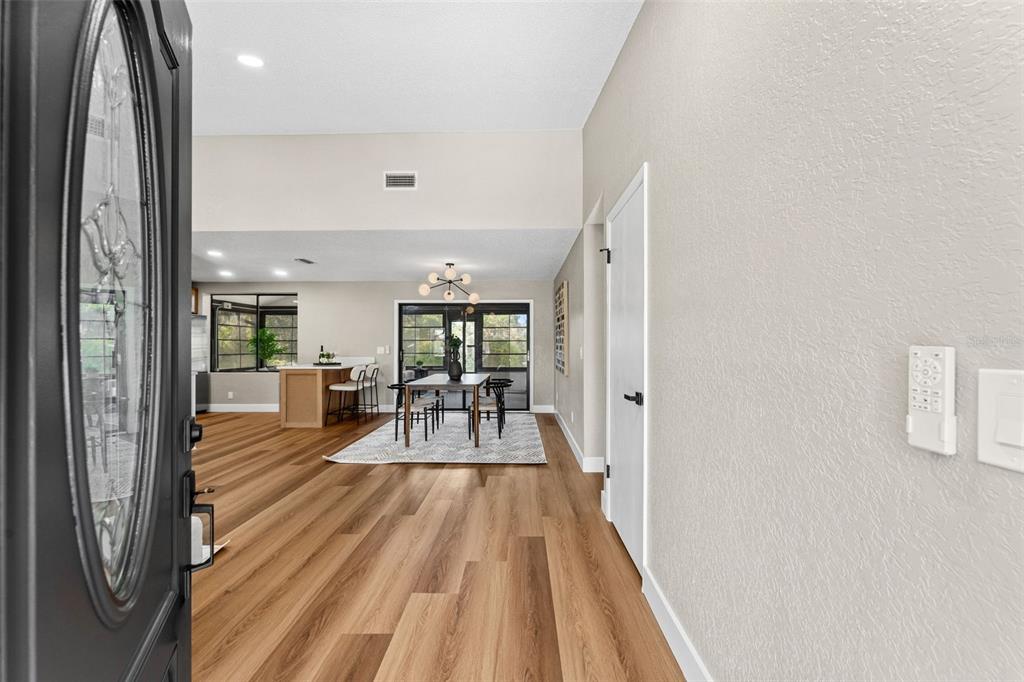 117 Poinciana Road Edgewater, FL 32141 - Photo 4 of 36 a view of a living room and a wooden floor