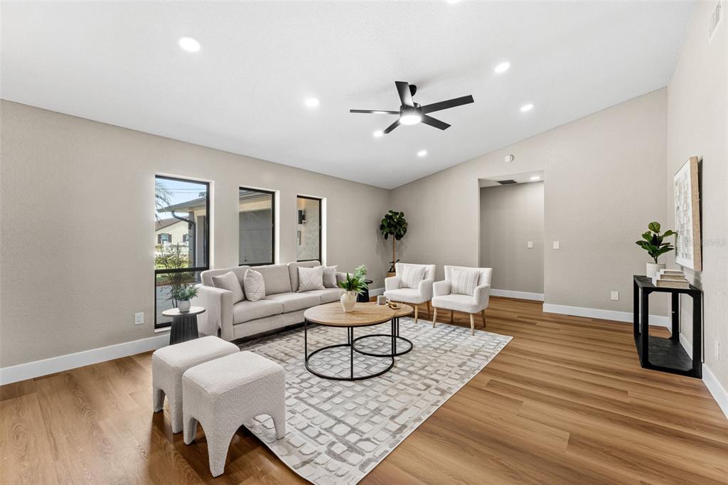117 Poinciana Road Edgewater, FL 32141 - Photo 6 of 36 a living room with furniture and a wooden floor
