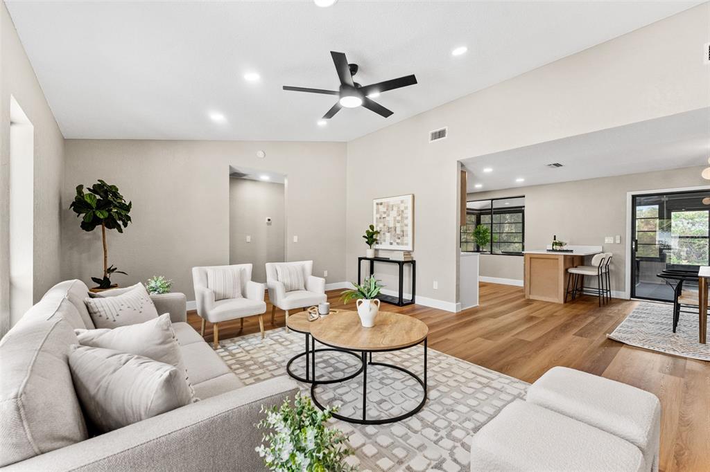 117 Poinciana Road Edgewater, FL 32141 - Photo 7 of 36 a living room with furniture and a view of kitchen