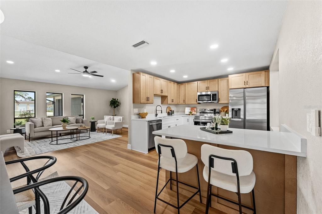 117 Poinciana Road Edgewater, FL 32141 - Photo 10 of 36 a kitchen with sink table and chairs