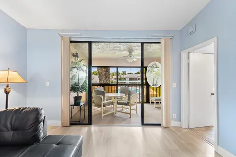 a spacious bedroom with a bed and a large window