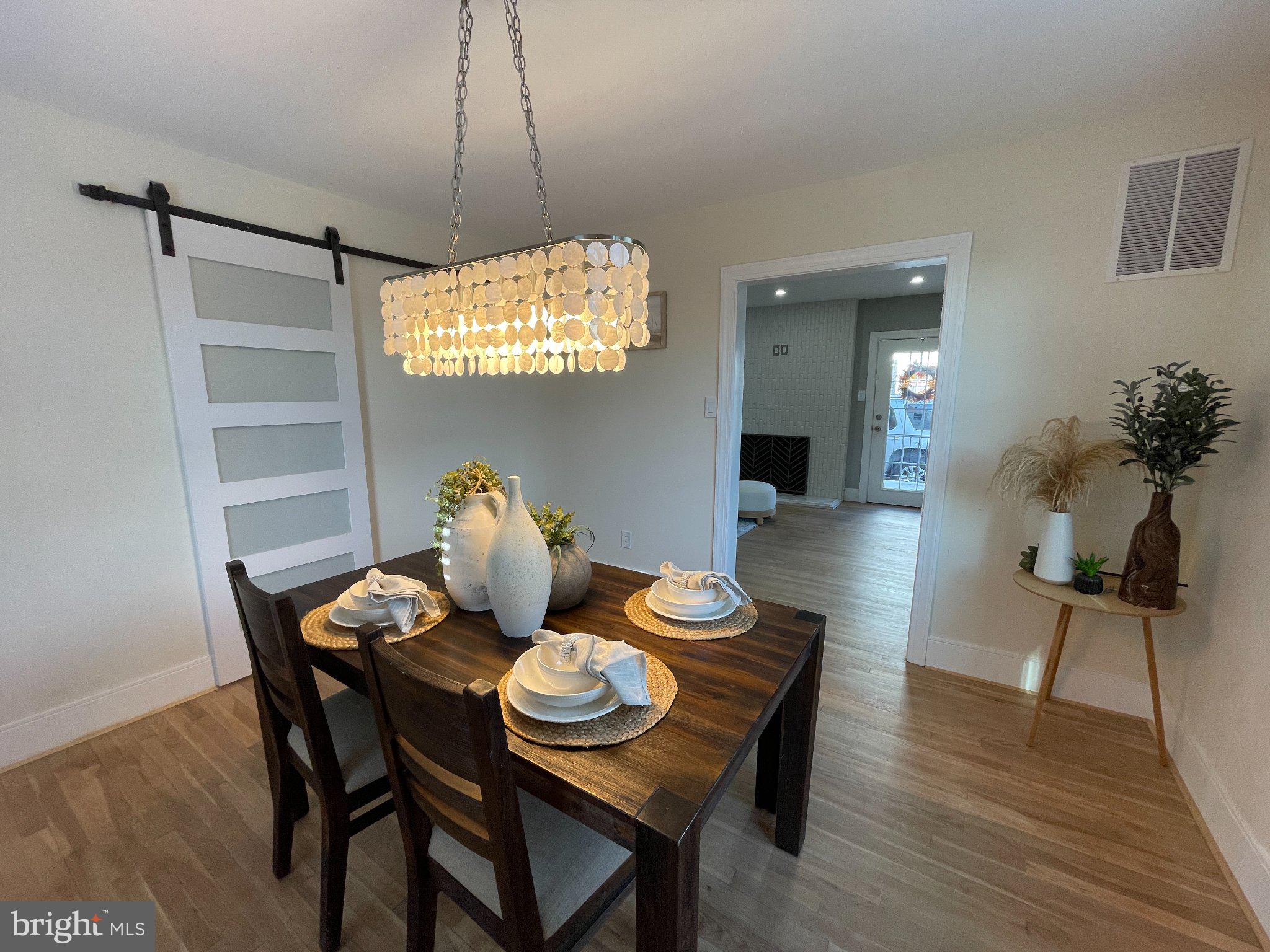3712 West Cold Spring Lane Baltimore, MD 21215 - Photo 14 of 39 Elegant dining space with modern charm.