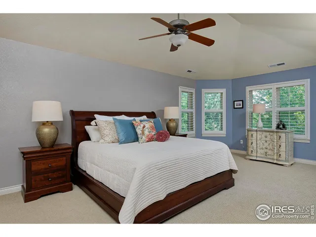 a bedroom with bed and window