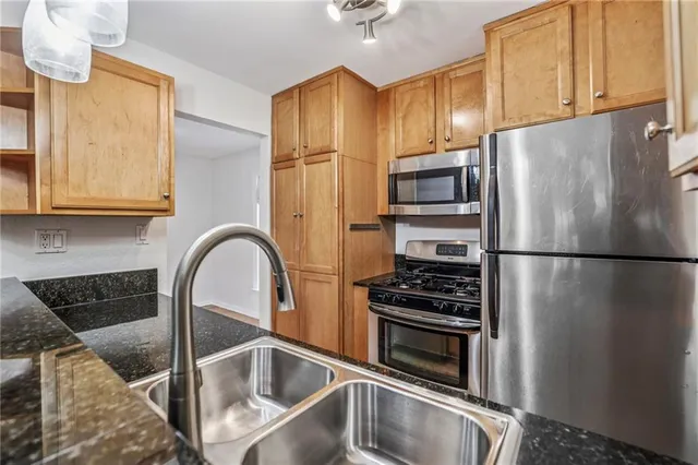 a kitchen with a sink and a stove
