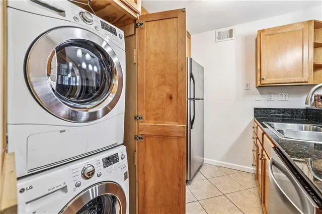 a bedroom with a bed and a potted plant