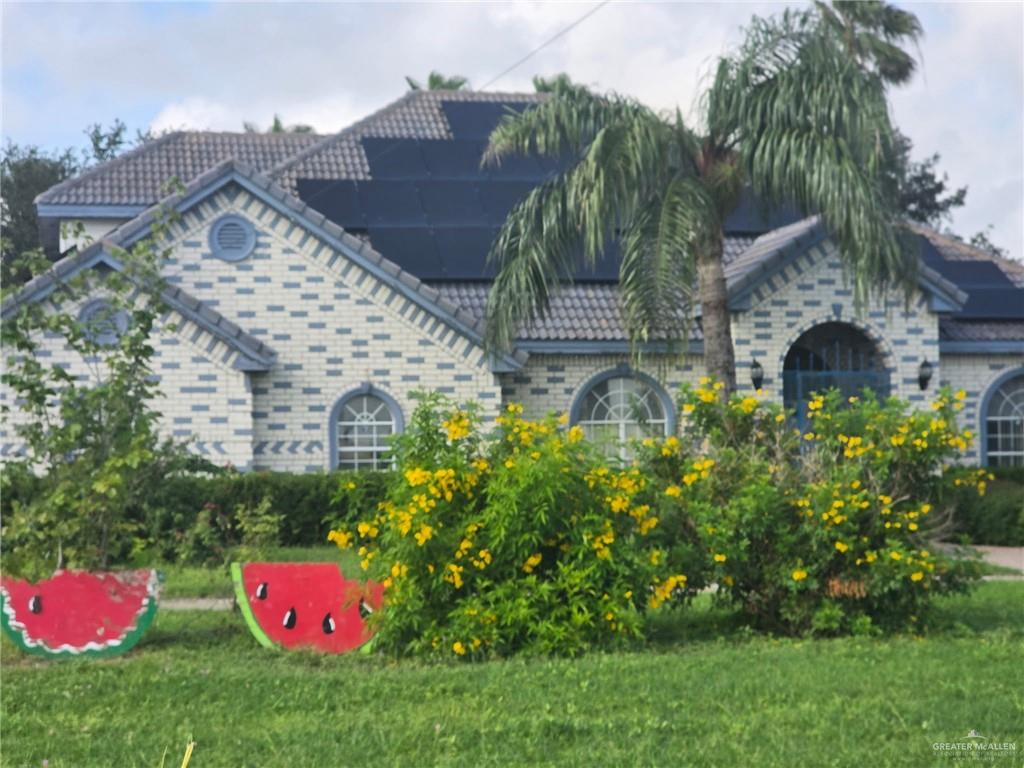 2210 West Monte Cristo Road Edinburg, TX 78541 - Photo 1 of 11 a view of a house with a yard and garden