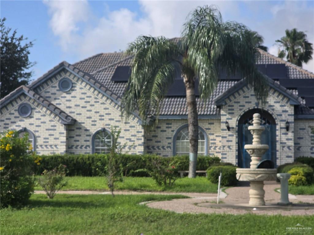 2210 West Monte Cristo Road Edinburg, TX 78541 - Photo 2 of 11 a front view of a house with a yard