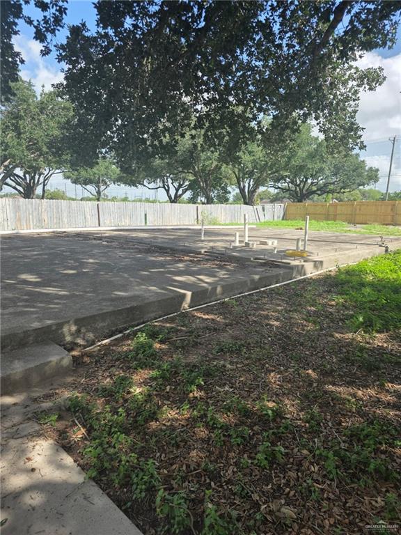2210 West Monte Cristo Road Edinburg, TX 78541 - Photo 8 of 11 a view of a yard with a large tree