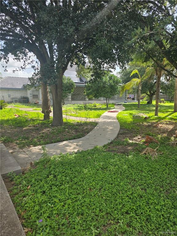 2210 West Monte Cristo Road Edinburg, TX 78541 - Photo 10 of 11 a view of yard with swimming pool and green space