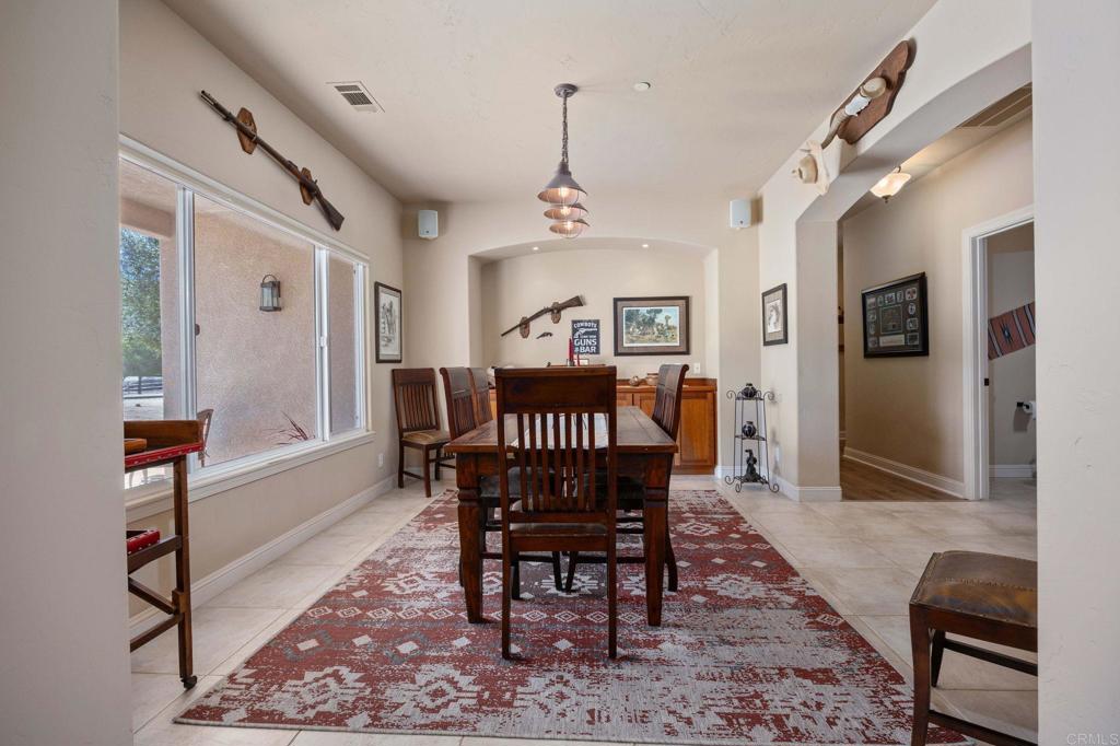 10204 Mt Olympus Valley Road Fallbrook, CA 92028 - Photo 13 of 59 a view of a a dining room with furniture window and wooden floor