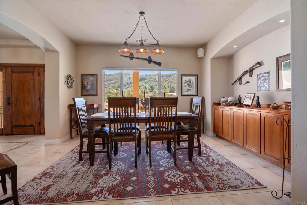 10204 Mt Olympus Valley Road Fallbrook, CA 92028 - Photo 14 of 59 a view of a dining room with furniture window and wooden floor