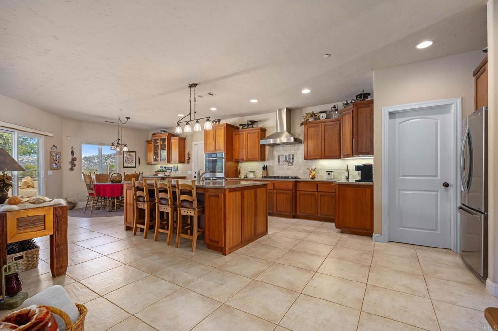 10204 Mt Olympus Valley Road Fallbrook, CA 92028 - Photo 16 of 59 a large kitchen with lots of counter space and appliances