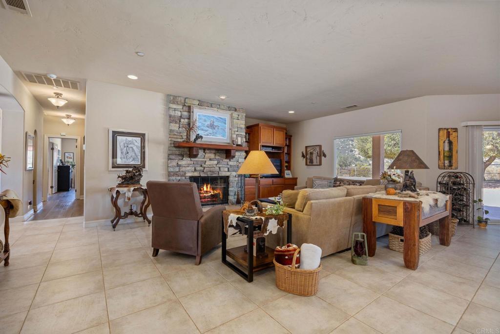 10204 Mt Olympus Valley Road Fallbrook, CA 92028 - Photo 24 of 59 a living room with furniture and a large window