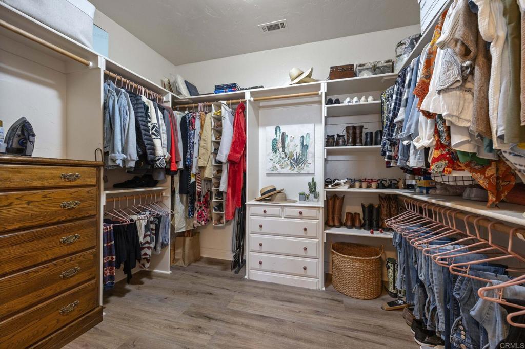 10204 Mt Olympus Valley Road Fallbrook, CA 92028 - Photo 30 of 59 a view of walk in closet with clothes and shoes