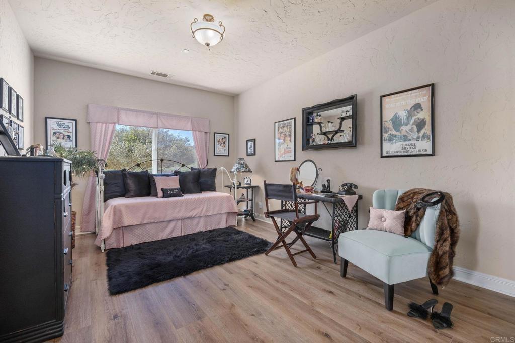 10204 Mt Olympus Valley Road Fallbrook, CA 92028 - Photo 31 of 59 a living room with furniture and a large window