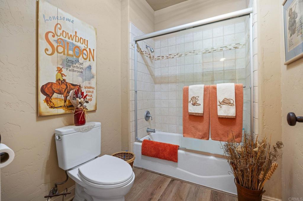 10204 Mt Olympus Valley Road Fallbrook, CA 92028 - Photo 33 of 59 a bathroom with a toilet sink and shower