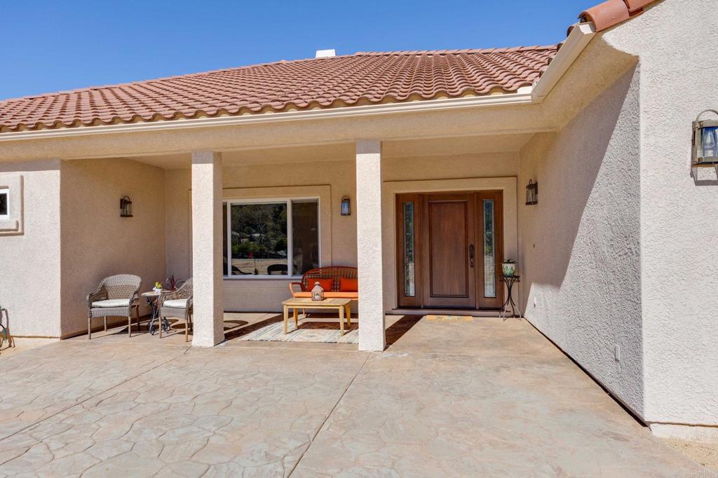 10204 Mt Olympus Valley Road Fallbrook, CA 92028 - Photo 9 of 59 a view of a building with seating space