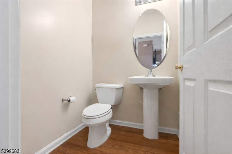 159 George Russell Way Clifton, NJ 07013 - Photo 12 of 25 a bathroom with a toilet and a sink
