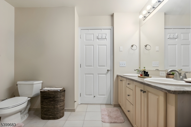 159 George Russell Way Clifton, NJ 07013 - Photo 17 of 25 a bathroom with a sink a toilet and mirror