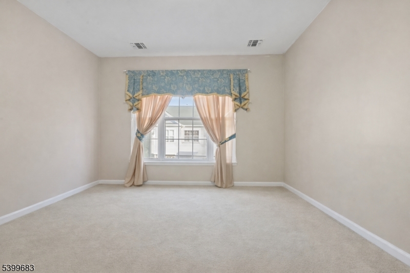 159 George Russell Way Clifton, NJ 07013 - Photo 19 of 25 an empty room with a empty space and windows