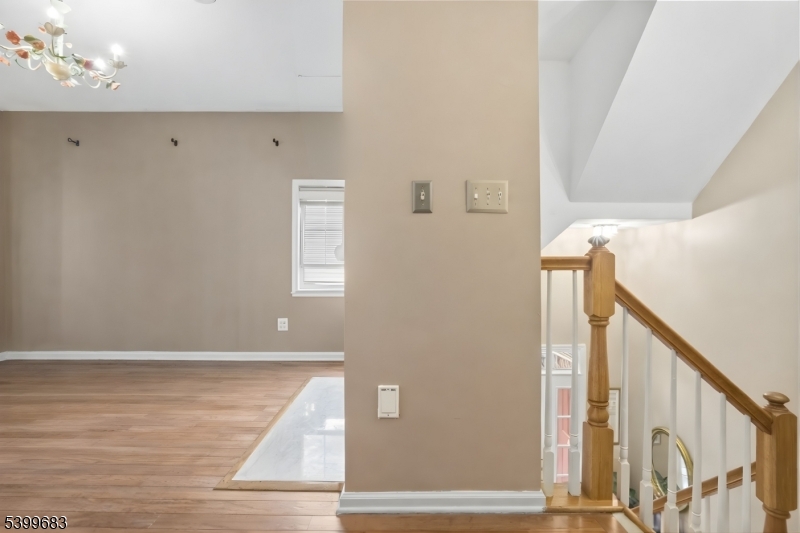 159 George Russell Way Clifton, NJ 07013 - Photo 4 of 25 a view of hallway with stairs