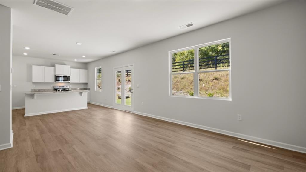 104 Oak View Lane Dallas, GA 30157 - Photo 15 of 39 a view of a kitchen with wooden floor and electronic appliances
