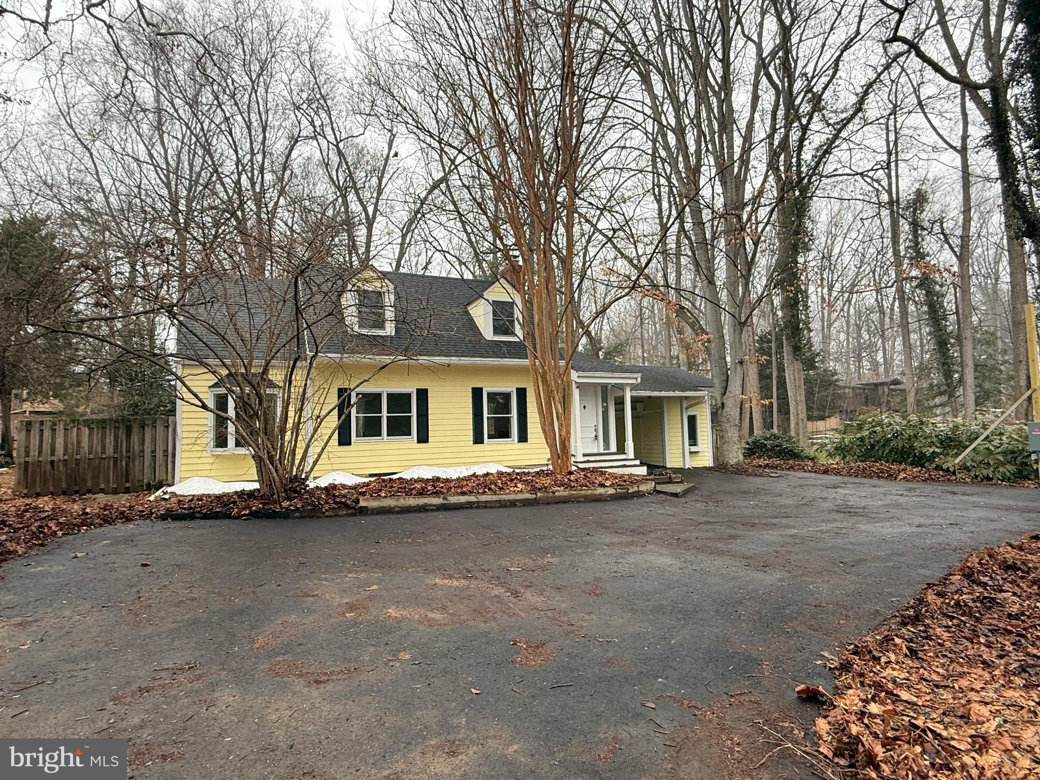 8620 Falls Road Potomac, MD 20854 - Photo 4 of 10 a front view of a house with a yard