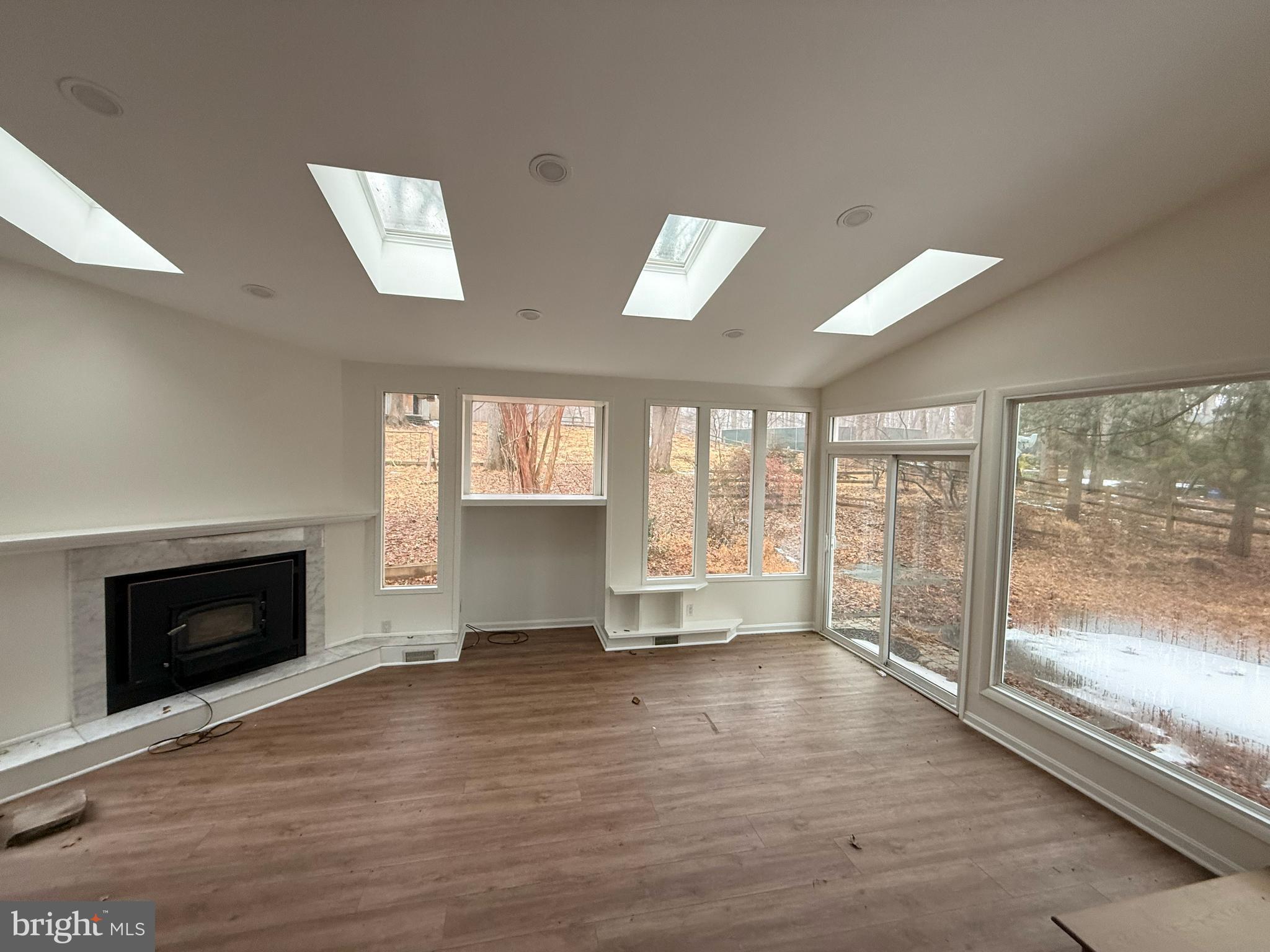 8620 Falls Road Potomac, MD 20854 - Photo 5 of 10 a view of empty room with wooden floor and fireplace