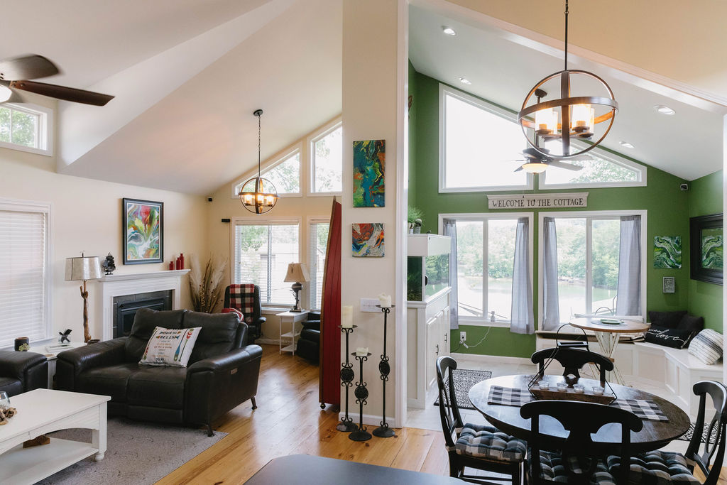 1230 Melton Road, Unit 87 West Union, SC 29696 - Photo 17 of 43 This living space features vaulted ceilings, a fireplace, and large windows with scenic outdoor views.