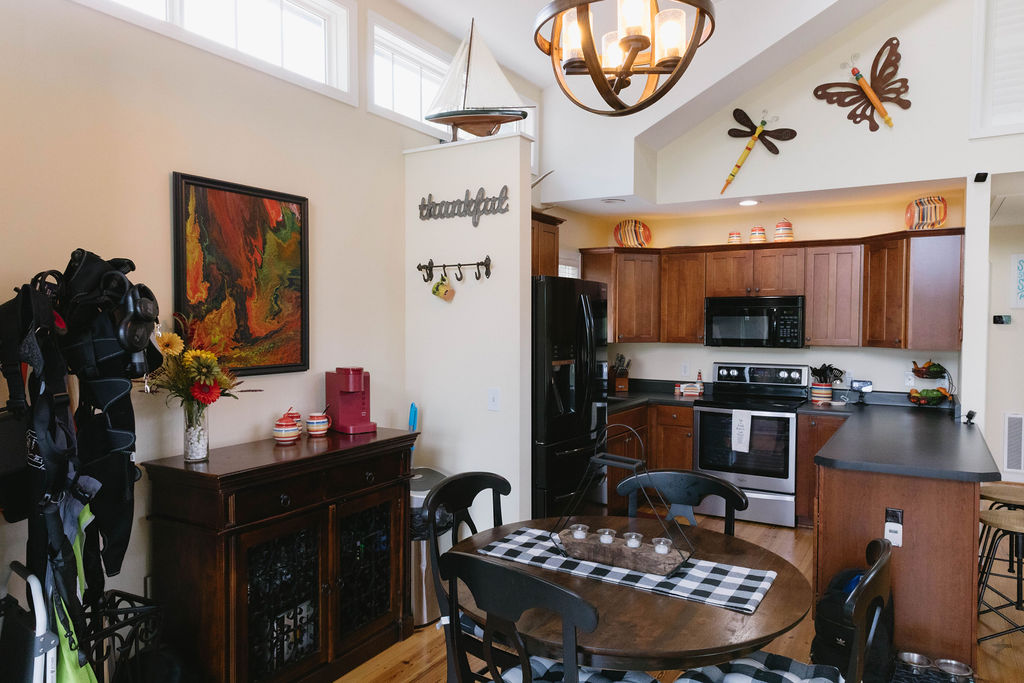 1230 Melton Road, Unit 87 West Union, SC 29696 - Photo 19 of 43 This spacious kitchen and dining area features vaulted ceilings, providing an open and airy atmosphere.
