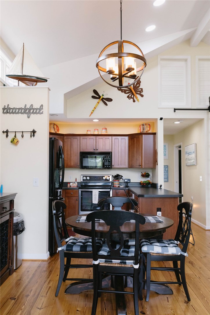 1230 Melton Road, Unit 87 West Union, SC 29696 - Photo 20 of 43 This cozy kitchen features a vaulted ceiling and rich wooden floors.