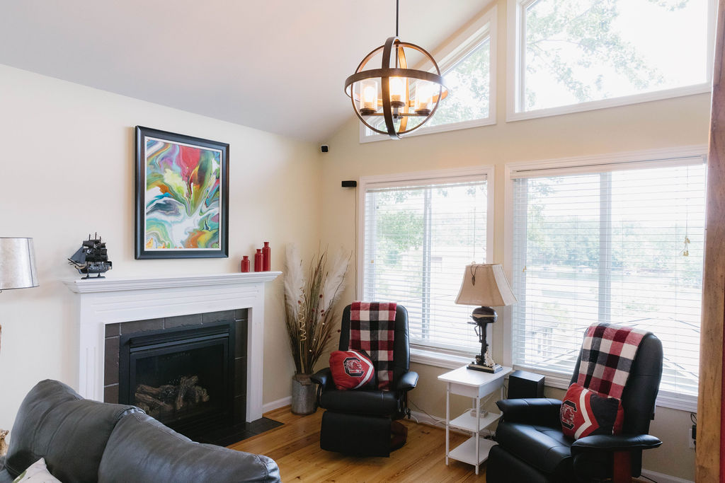1230 Melton Road, Unit 87 West Union, SC 29696 - Photo 22 of 43 This inviting living area boasts large windows, a classic fireplace, and warm hardwood floors.